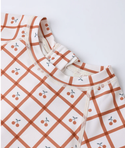 DELPHINE RASHGUARD ONE-PIECE CHERRY CHECK