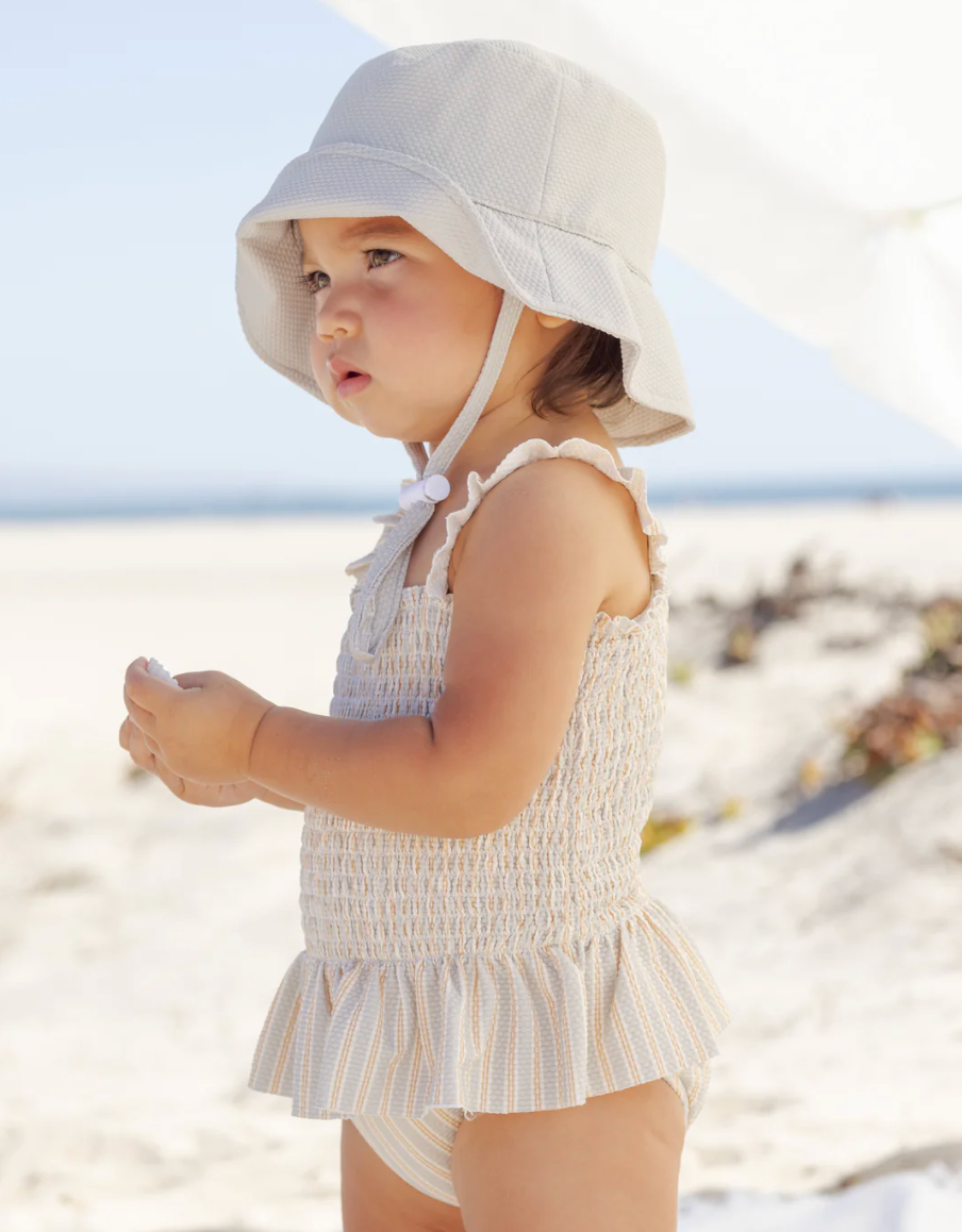 SMOCKED ONE-PIECE SWIMSUIT BLUE + BUTTERSCOTCH STRIPE